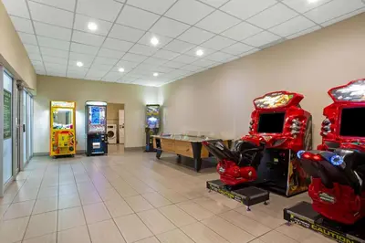 a arcade with arcade games and consoles in a room at La Quinta by Wyndham Springfield in Springfield