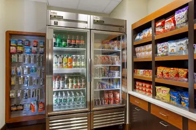 a refrigerator filled with lots of drinks and food at La Quinta by Wyndham Springfield in Springfield