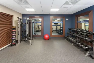 a gym with tread machines and a red ball at Hampton Inn & Suites Rocky Hill - Hartford South in Rocky Hill