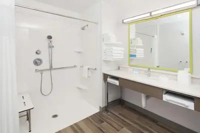 a white bathroom with a sink and a shower at Hampton Inn & Suites Rocky Hill - Hartford South in Rocky Hill