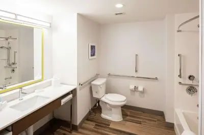 a white bathroom with a toilet and a sink at Hampton Inn & Suites Rocky Hill - Hartford South in Rocky Hill