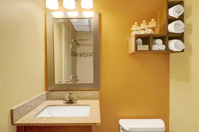 a bathroom with a sink and a toilet at Days Inn by Wyndham Southington in Southington