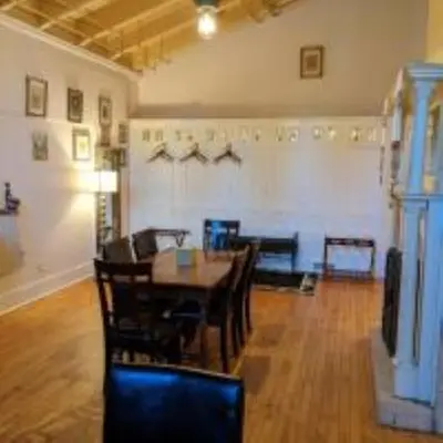 a dining room with a table and chairs at Amsterdam Castle NY in Amsterdam