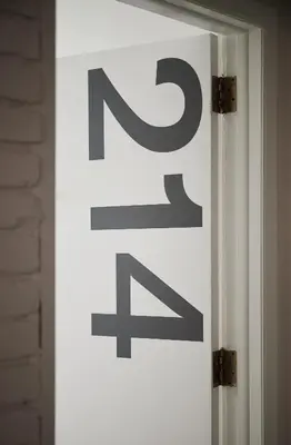a sign on the side of a door at Bluebird Spa City Motor Lodge in Saratoga Springs