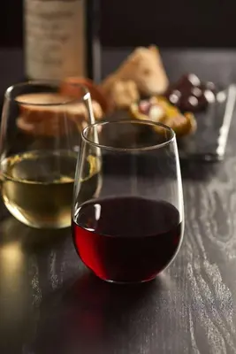 two glasses of wine sitting on a table at Hyatt Place Saratoga/Malta in Malta