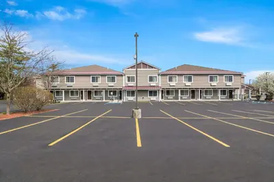 an empty parking lot in front of a large building at Quality Inn Queensbury - Lake George Area in Queensbury