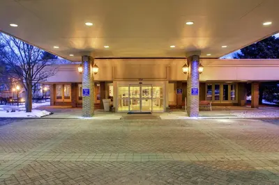 a large building with pillars in front of it at Holiday Inn Express Poughkeepsie by IHG in Poughkeepsie