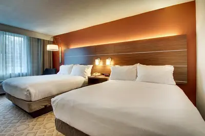 a hotel room with two beds and a window at Holiday Inn Express Poughkeepsie by IHG in Poughkeepsie