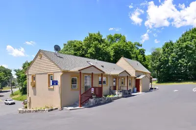 a building on the side of a street at Golden Hill Inn-Danbury in Danbury