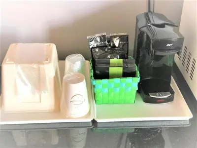 a shelf with a coffee maker and a coffeemaker at Countryside Inn Richmondville in Richmondville