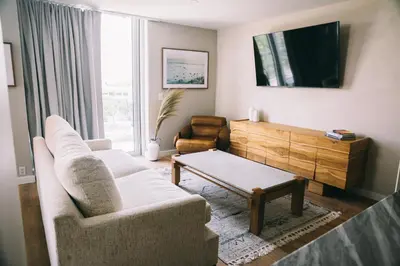 a living room with a couch and a coffee table at CODA Williamsburg in Brooklyn