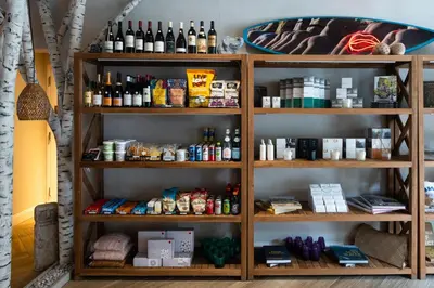 a book shelf filled with lots of bottles of alcohol at CODA Williamsburg in Brooklyn