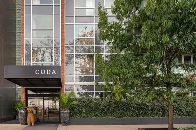 a building with a coda sign in front of it at CODA Williamsburg in Brooklyn