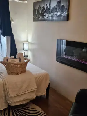 a room with a bed with a basket on a table at Harlem Brownstone in New York