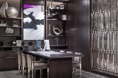 a office with a desk with chairs and a monitor at Residence Inn by Marriott Weehawken in Weehawken