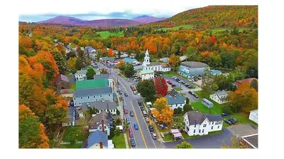 an aerial view of a small town in the fall at Townhouse W Private Deck & Mt View in Windham