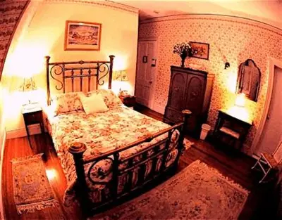 a bedroom with a large bed in a room at Whistler's Inn in Lenox