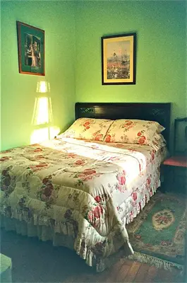 a bedroom with a bed with a quilt on it at Whistler's Inn in Lenox
