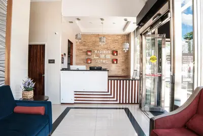 a lobby with a bar in a building at Madison LES Hotel in New York