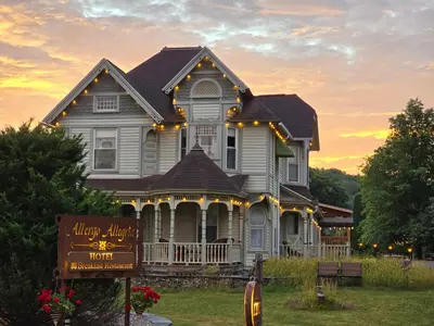 a house with a sign in front of it at Albergo Allegria Hotel & Breakfast Restaurant in Windham