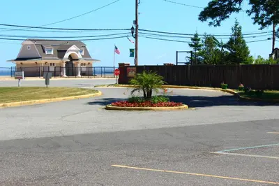 a street with a palm tree in a flower bed at Tides Inn at Stehli Beach in Locust Valley