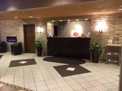 a lobby of a restaurant with a reception desk at Super 8 by Wyndham Schenectady/Albany Area in Schenectady
