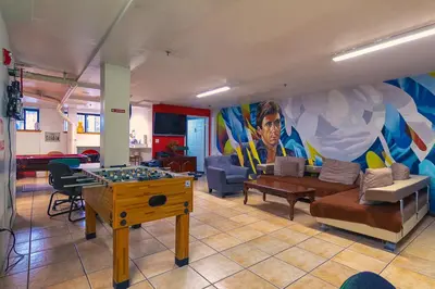 a living room with a couch and a table at NY Moore Hostel in Brooklyn