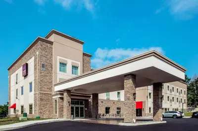 a large brick building with a parking lot at Comfort Suites Fishkill near Interstate 84 in Fishkill