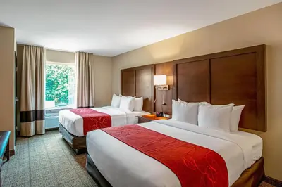 a hotel room with two beds and a window at Comfort Suites Fishkill near Interstate 84 in Fishkill