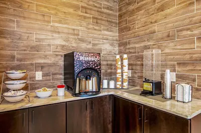 a kitchen with a coffee maker on a counter at Comfort Suites Fishkill near Interstate 84 in Fishkill
