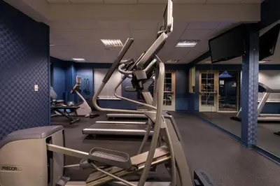 a gym with tread machines and a treadmill at Holiday Inn Express and Suites Dickson City by IHG in Dickson City