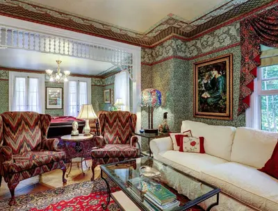 a living room with a couch and chairs and a table at Fairlawn Inn in Hunter