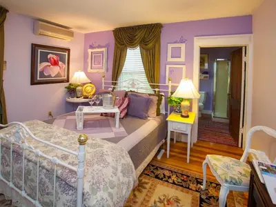 a bedroom with a bed and a living room at Fairlawn Inn in Hunter