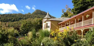 a house in the middle of a garden at Fairlawn Inn in Hunter