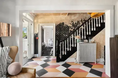 a living room with a black and white checkered floor at Twin Gables of Woodstock in Woodstock