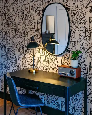 a desk with a mirror and a table with a chair at Twin Gables of Woodstock in Woodstock