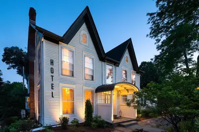 a white house with a black roof at Twin Gables of Woodstock in Woodstock