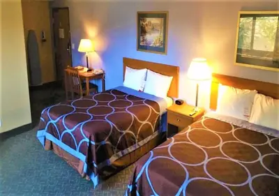 a hotel room with two beds and two lamps at Super 8 by Wyndham Mahwah in Mahwah