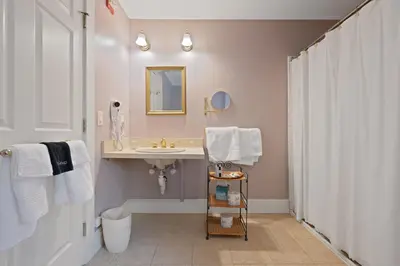 a bathroom with a sink and a mirror at Brook Farm Inn in Lenox
