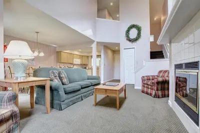 a living room with a couch and a fireplace at Pocono Mountain Villas MOD Collection by Sonesta in East Stroudsburg