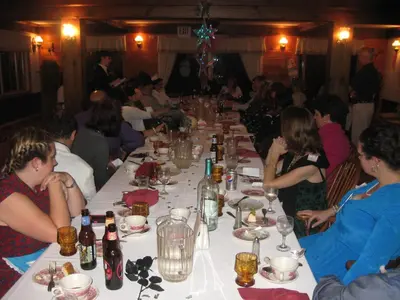 a group of people sitting at a long table at Big Bears Lodge in West Dover
