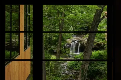 a view of a waterfall from a window at Woodstock Way Hotel in Woodstock