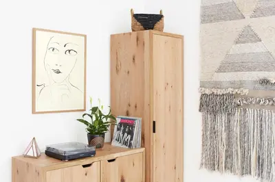 a room with a wooden cabinet and a picture at Woodstock Way Hotel in Woodstock