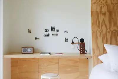 a bedroom with a bed and a desk with a radio at Tourists in North Adams