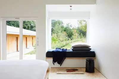 a bed in a room with a window at Tourists in North Adams