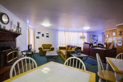 a living room with a couch and a table at Margaretville Motel in Margaretville