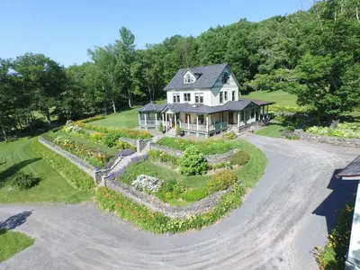 an aerial view of a house with a garden at Breezy Hill Inn in Fleischmanns