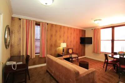 a living room with a couch and a table at Radio City Apartments in New York