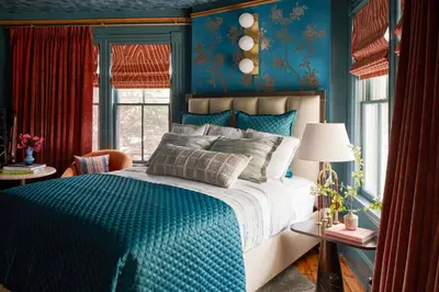 a blue bedroom with a bed and a blue wall at The Cornell Inn, Lenox & The Berkshires in Lenox