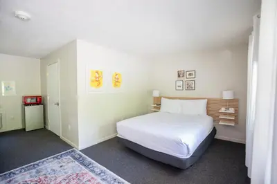 a bedroom with a large white bed in a room at The Little Lion in Great Barrington